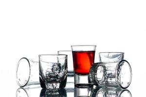 Collage of glasses with alcohol on a white background. photo