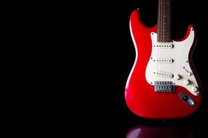 Electric guitar on black background. Free space for text photo