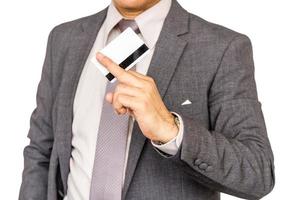 Close up of businessman holding credit card  isolated on white background. photo