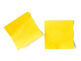 Yellow stick notes paper on white background. photo