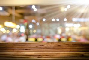 Wooden table with blur bokeh background photo