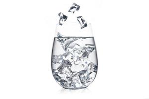 Glass of water with ice cubes on white background. photo