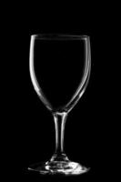 Glass of wine on black background. photo