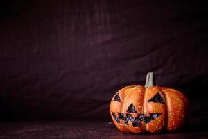 Halloween pumpkin on a black background. Vintage tone. Free space for text photo