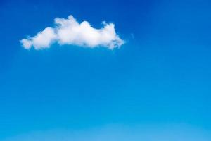 White clouds in a blue sky. Free space for text photo