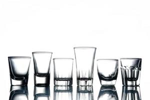 Collage of empty glasses on white background. photo