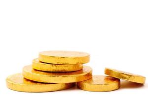 Gold coin stack on a white background. Free space for text photo