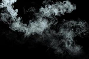 Abstract powder or smoke isolated on black background photo