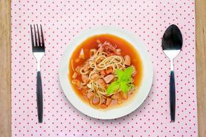 Spaghetti pasta with spoon and fork photo