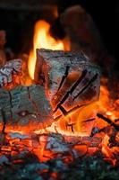 Crest of flame on burning wood in fireplace. Burning firewood in a Russian stove. photo