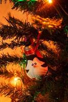 Christmas decorations. New Year's toys - penguin on a New Year tree. Merry Christmas and Happy New Year. photo