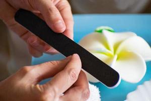 Manicure at home. A woman polishing her fingernails. Nail Care. photo