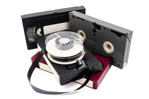 Video cassette tapes and reel on white background. photo