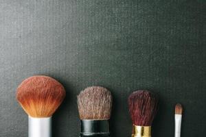 Makeup brushes on black background, Free space for text. photo