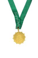 Gold medal with green ribbon on white background photo