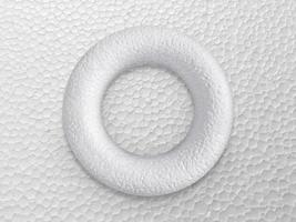 Styrofoam circle isolated on white foam background, top view photo