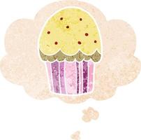 cupcake de dibujos animados y burbuja de pensamiento en estilo retro texturizado vector