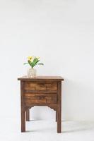 brown wood table in white room. photo