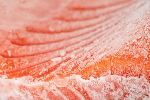 closeup piece of frozen salmon fillet photo