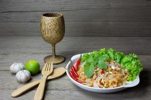 salad with dried shrimp on table photo