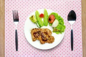 Grilled steak meat with spoon and fork photo