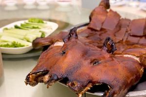 Barbecued suckling pig in restaurant photo