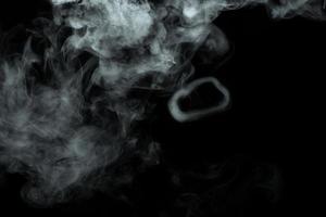 Abstract powder or smoke isolated on black background photo