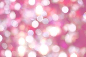 Abstract blurred and bokeh of white reflection lighting on pink background. photo