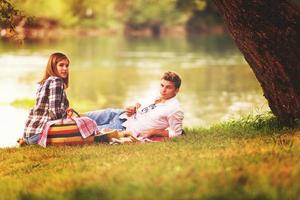 Couple in love enjoying picnic time photo