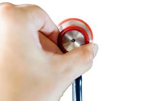 Closeup and crop hands of human holding a small doctor stethoscope on white background and make with path. photo