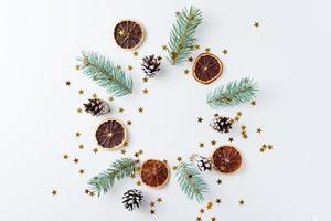 Christmas background made of pine cones and fir tree photo