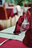 restaurant table with empty wine glass photo