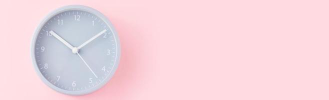 Gray alarm clock on a pink background with copy space, top view, long banner photo