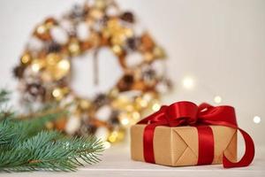 Christmas gift box with ribbon and christmas decorations photo