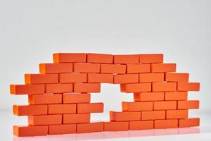 White hole in a brick wall. Frame of Toy block in shape of brick photo