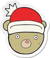 sticker of a cartoon teddy bear wearing christmas hat vector