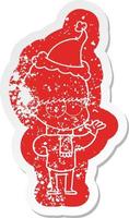 nervous cartoon distressed sticker of a boy wearing santa hat vector