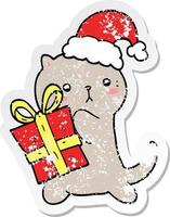 distressed sticker of a cute cartoon cat carrying christmas present vector