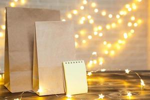 Christmas decor of food delivery service disposable kraft paper package. Ready-made order, eco-friendly recyclable packaging, zero waste. Holidays catering, making sweets home made. mock up, tag