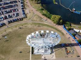 Beautiful Aerial Drone's Camera  Footage of Willen Lake and Park which is located at Milton Keynes, England. People are Enjoying at Lake on a Hot Sunny Day of Summer. Video Clip Captured on 21-8-2022 photo