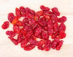 Dried Tomatoes on wood backgrund. photo