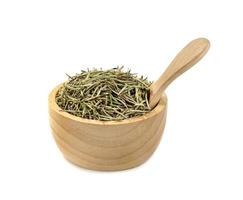 Dry rosemary in wooden bowl and spoon isolated on white background photo