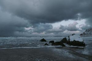 norway coast in winter with snow bad cloudy weather photo