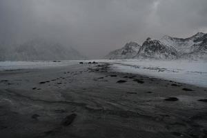 norway coast in winter with snow bad cloudy weather photo