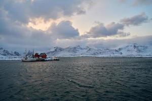 Traditional Norwegian fisherman's cabins and boats photo