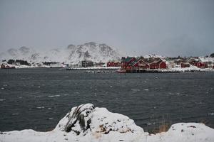 Traditional Norwegian fisherman's cabins and boats photo