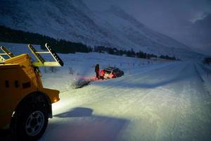 Car being towed after accident in snow storm photo