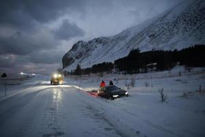 Car being towed after accident in snow storm photo