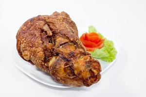 fried pork leg cooked on background photo