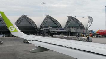 BANGKOK, THAILAND NOVEMBER 30, 2017 - Airplanes on apron of Subvarnabhumi airport, view fom taxiing aircraft video